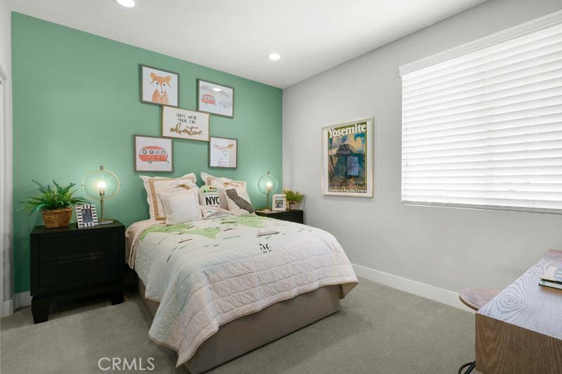 38924 Malva Rosa Drive Palmdale, CA 93551 - Photo 16 of 25 a bedroom with a bed and a window