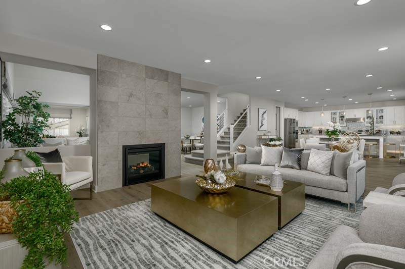 38924 Malva Rosa Drive Palmdale, CA 93551 - Photo 2 of 25 a living room with furniture and a fireplace