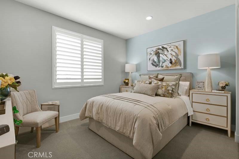 38924 Malva Rosa Drive Palmdale, CA 93551 - Photo 21 of 25 a bedroom with a bed and a painting on the wall