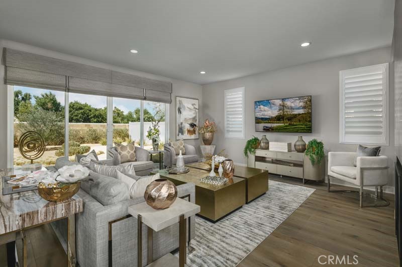 38924 Malva Rosa Drive Palmdale, CA 93551 - Photo 3 of 25 a living room with furniture large window and a wooden floor
