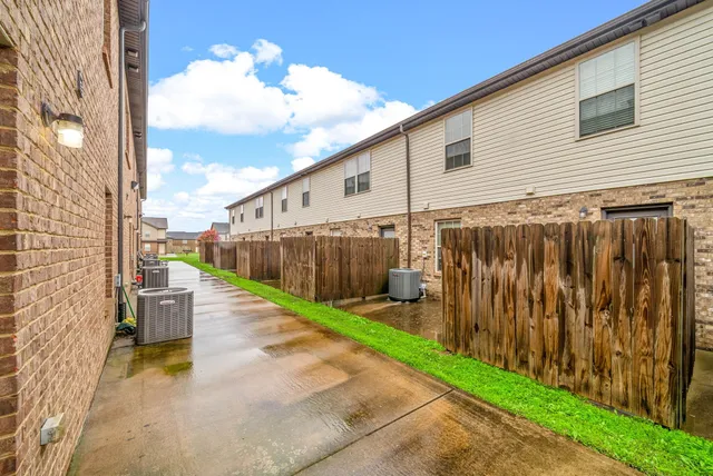 a view of a back yard with a chair