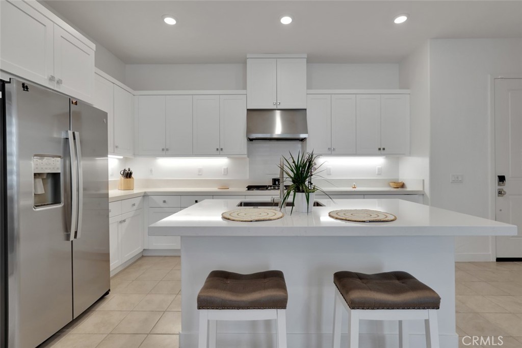145 Sash Irvine, CA 92618 - Photo 9 of 20 a kitchen with stainless steel appliances granite countertop a sink and a refrigerator