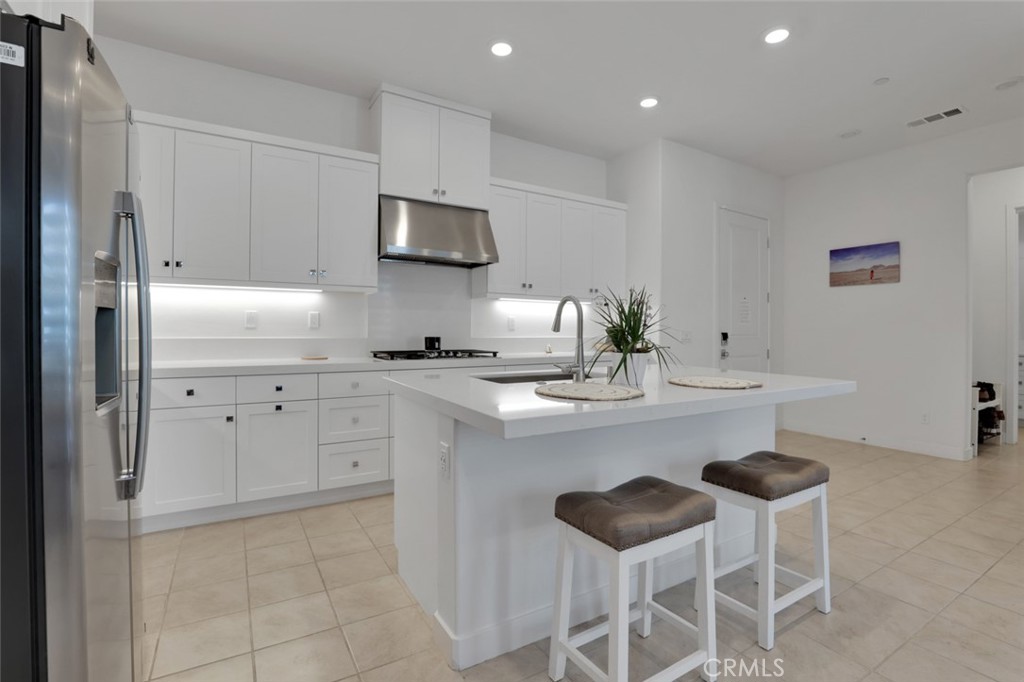 145 Sash Irvine, CA 92618 - Photo 10 of 20 a kitchen with stainless steel appliances a sink and a refrigerator
