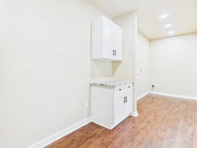 a view of a kitchen with a sink and cabinet area