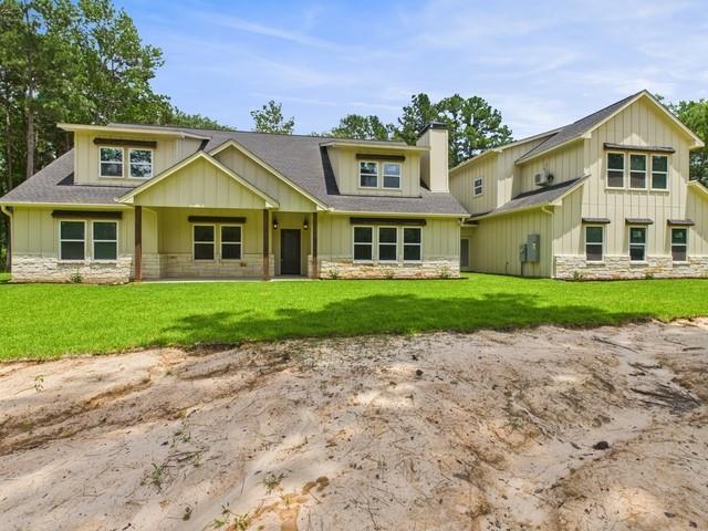 910 Cream Level Road Athens, TX 75751 - Photo 37 of 40 a front view of a house with a yard and potted plants