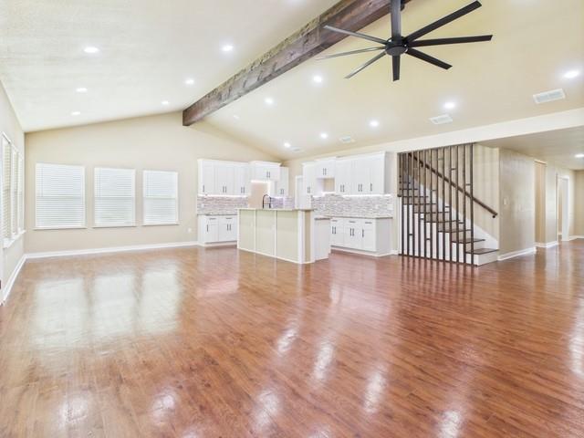 910 Cream Level Road Athens, TX 75751 - Photo 5 of 40 a view of a kitchen with refrigerator and wooden floor