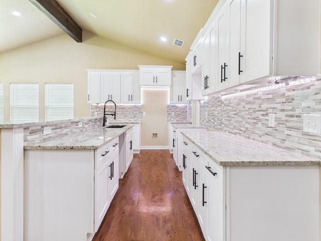 910 Cream Level Road Athens, TX 75751 - Photo 7 of 40 a large kitchen with granite countertop a sink and cabinets