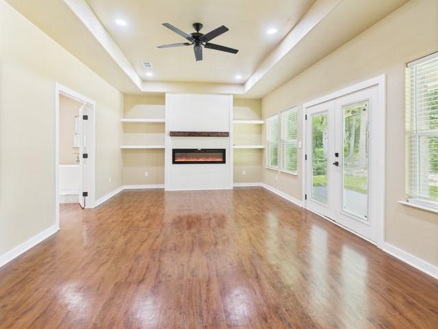 910 Cream Level Road Athens, TX 75751 - Photo 9 of 40 a view of empty room with wooden floor and window