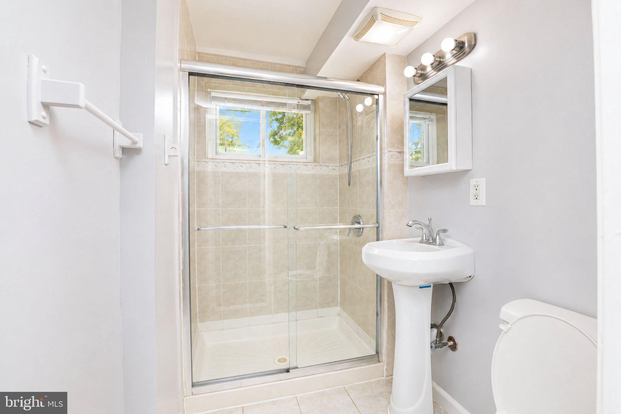 5712 Ash Drive Springfield, VA 22150 - Photo 31 of 38 Modern bathroom with natural light.