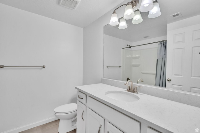 3269 West 650 North Layton, UT 84041 - Photo 32 of 35 Bathroom vanity featuring a single basin, brushed nickel faucet, and a light-toned countertop