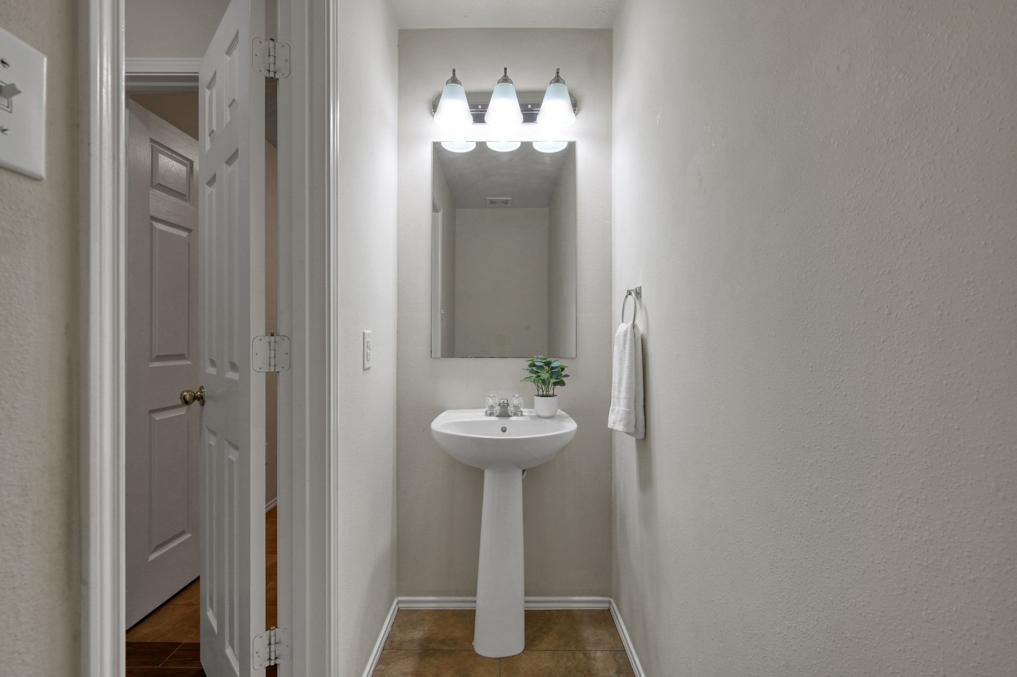 23919 Kingbriar Drive Spring, TX 77373 - Photo 18 of 33 The convenient first floor half bath is perfectly positioned for guests.