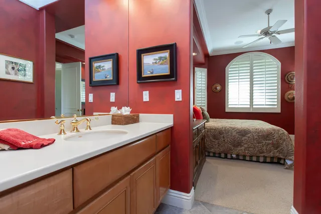 a bedroom with a bed and a mirror