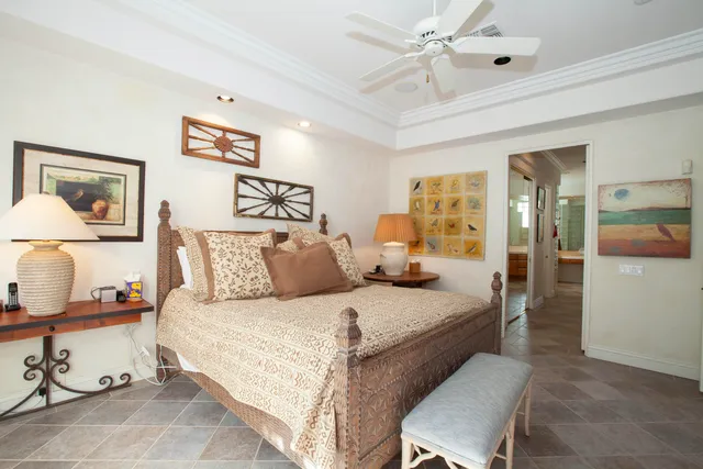 a bedroom with a bed and a table