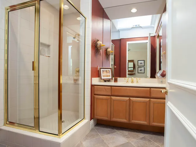 a bathroom with a double vanity sink and a mirror