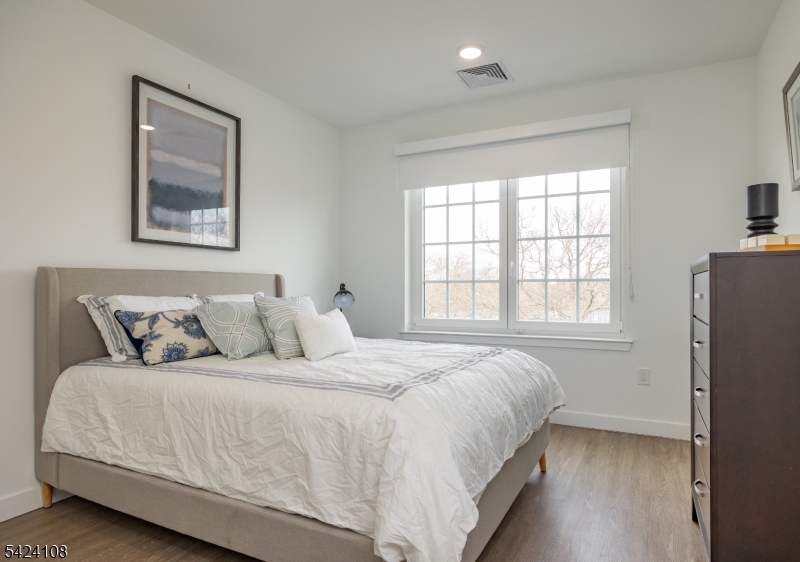 558 Market Street Newark, NJ 07105 - Photo 10 of 17 a bedroom with a bed and a window