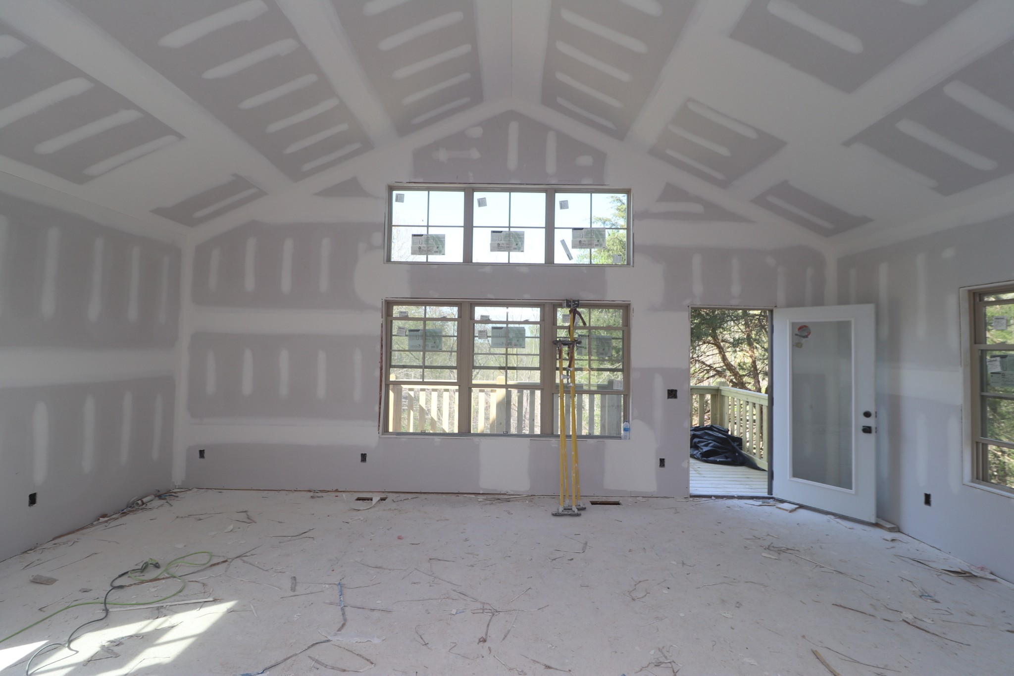 616 Kirbytown Road Lafayette, TN 37083 - Photo 5 of 6 an empty room with a fireplace and windows