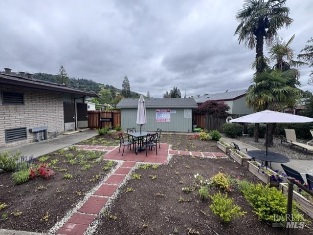 139 Coronado Circle Santa Rosa, CA 95409 - Photo 20 of 23 a view of a patio with a table and chairs under an umbrella