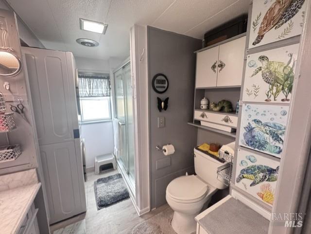 139 Coronado Circle Santa Rosa, CA 95409 - Photo 8 of 23 a bathroom with a toilet sink and shower curtain