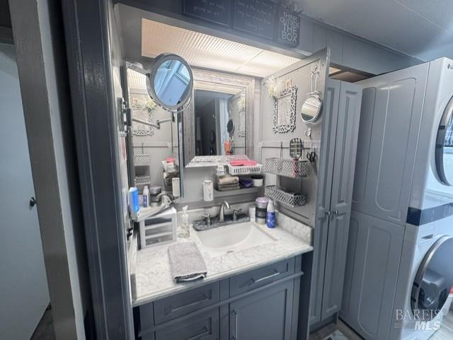 139 Coronado Circle Santa Rosa, CA 95409 - Photo 9 of 23 a room with a sink a mirror and a clock on the wall