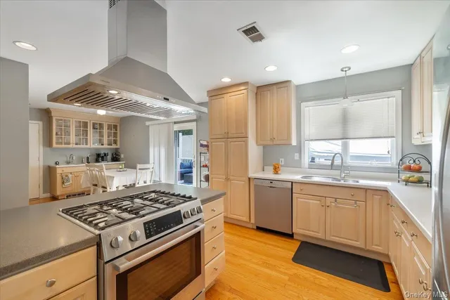 a kitchen with a stove and a sink