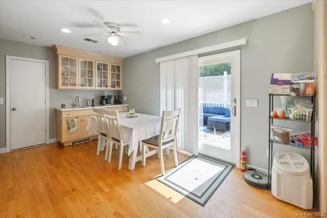 a living room with a baby crib furniture and a dining table