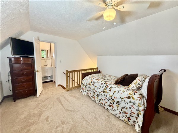 238 Trails End Road Blue Ridge, GA 30513 - Photo 22 of 32 a bedroom with a bed and a television