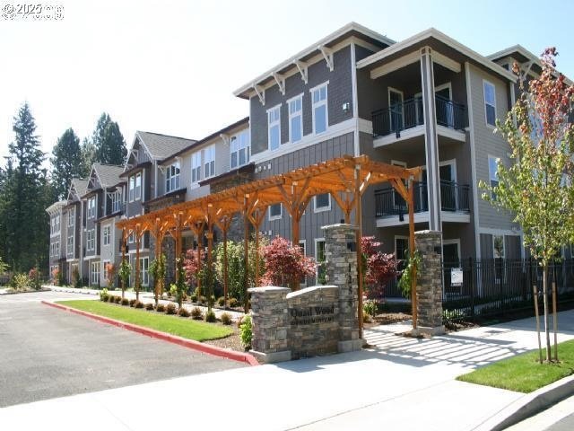 1258 Northwest Shattuck Way, Unit 309 Gresham, OR 97030 - Photo 1 of 33 a street view of a building