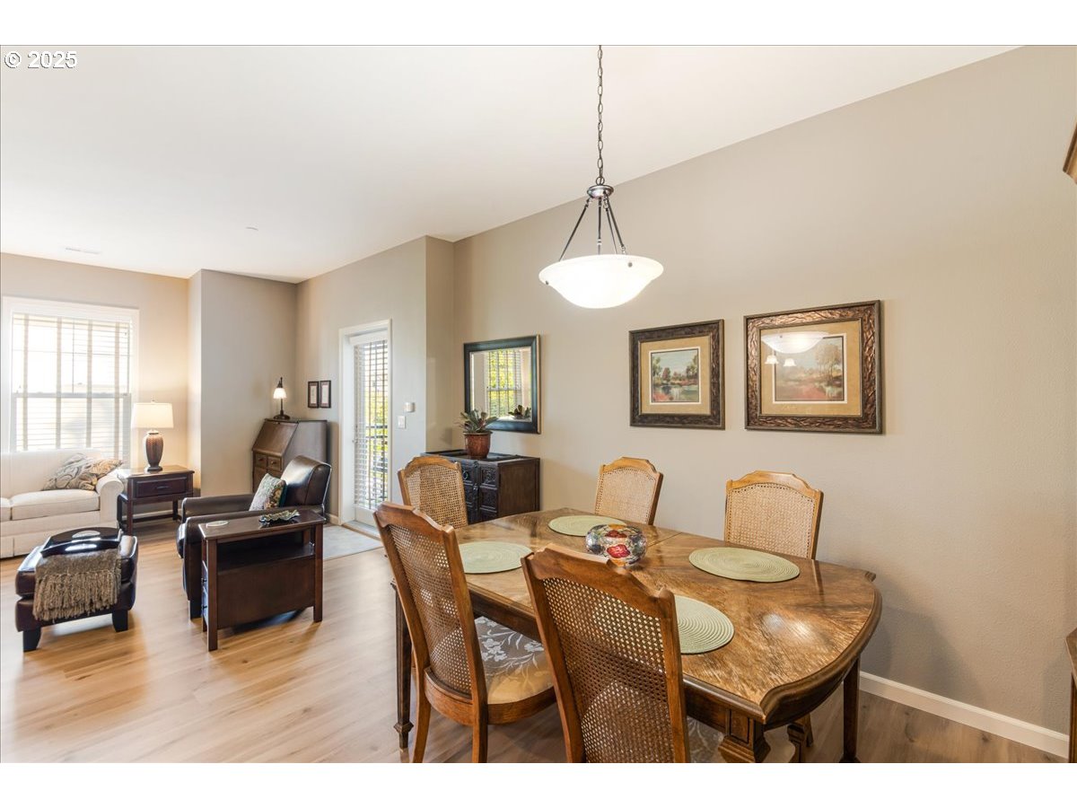 1258 Northwest Shattuck Way, Unit 309 Gresham, OR 97030 - Photo 14 of 33 a living room with furniture and a chandelier