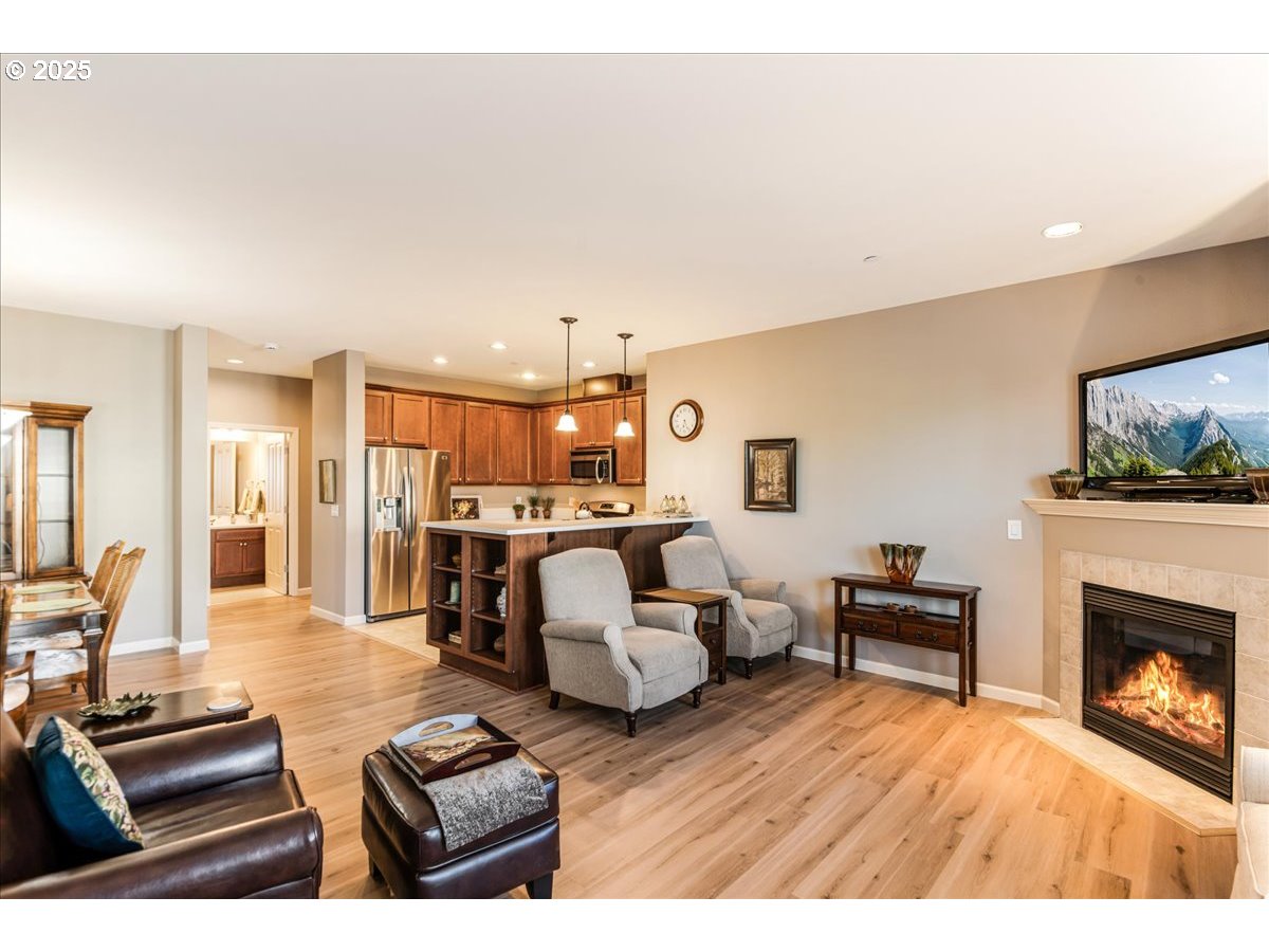 1258 Northwest Shattuck Way, Unit 309 Gresham, OR 97030 - Photo 17 of 33 a living room with furniture and a fireplace