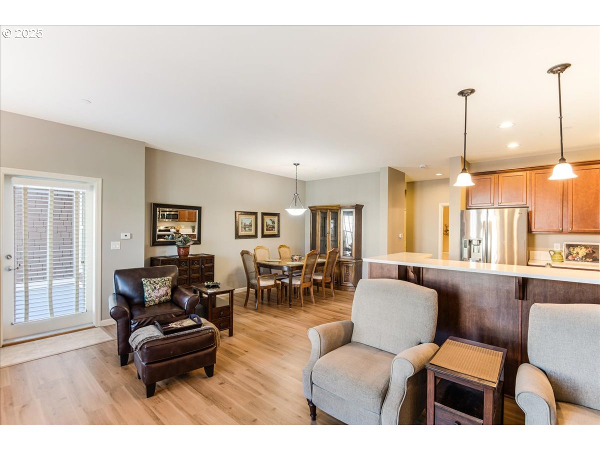 1258 Northwest Shattuck Way, Unit 309 Gresham, OR 97030 - Photo 18 of 33 a living room with furniture and a large window