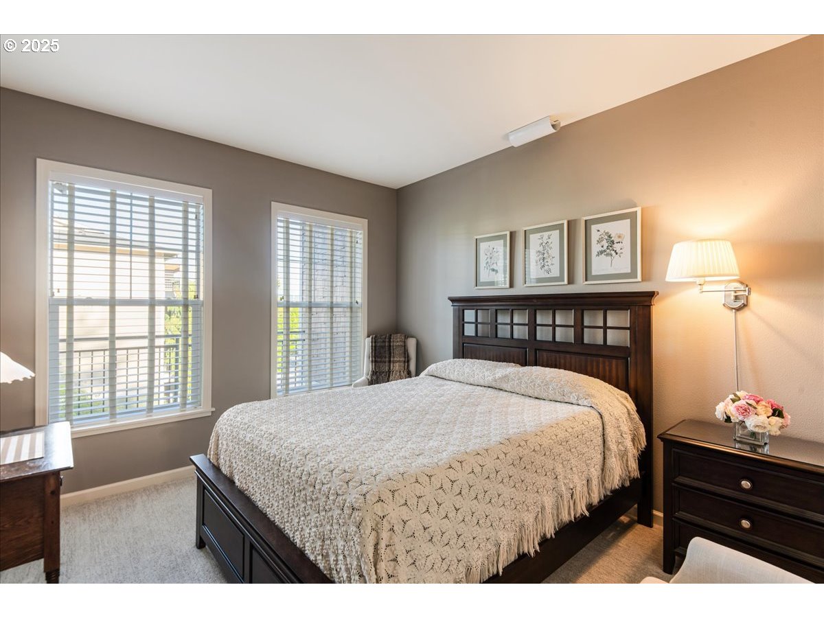 1258 Northwest Shattuck Way, Unit 309 Gresham, OR 97030 - Photo 21 of 33 a bedroom with a bed and a window
