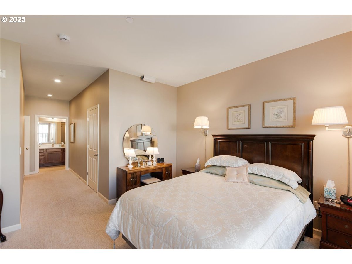 1258 Northwest Shattuck Way, Unit 309 Gresham, OR 97030 - Photo 25 of 33 a bedroom with a bed and a large mirror
