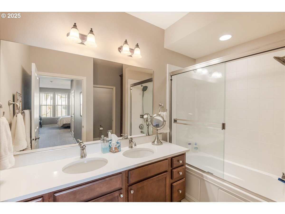 1258 Northwest Shattuck Way, Unit 309 Gresham, OR 97030 - Photo 27 of 33 a bathroom with a sink double vanity and a mirror