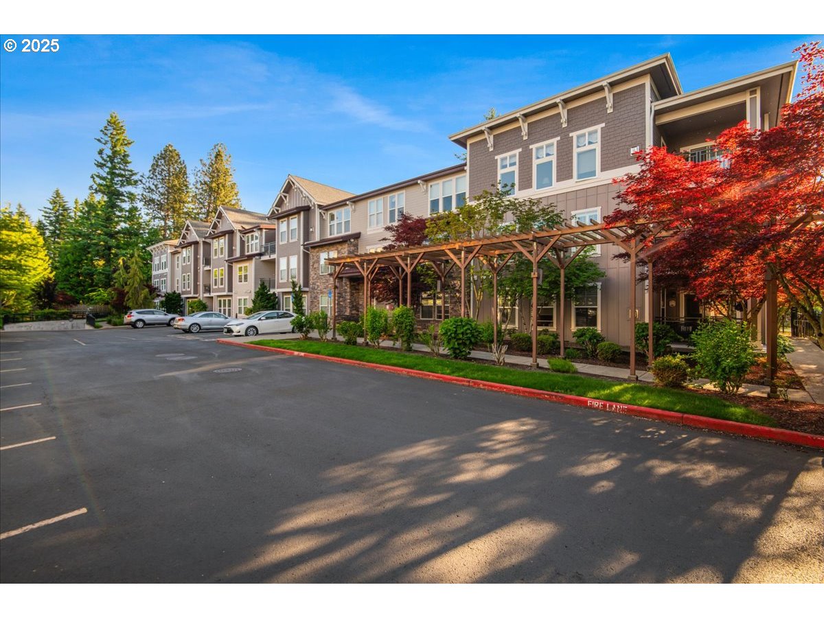 1258 Northwest Shattuck Way, Unit 309 Gresham, OR 97030 - Photo 3 of 33 a view of a street with a building in the background