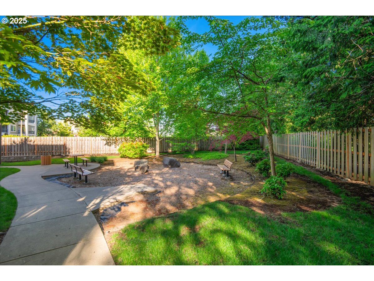1258 Northwest Shattuck Way, Unit 309 Gresham, OR 97030 - Photo 32 of 33 a view of a backyard with sitting area