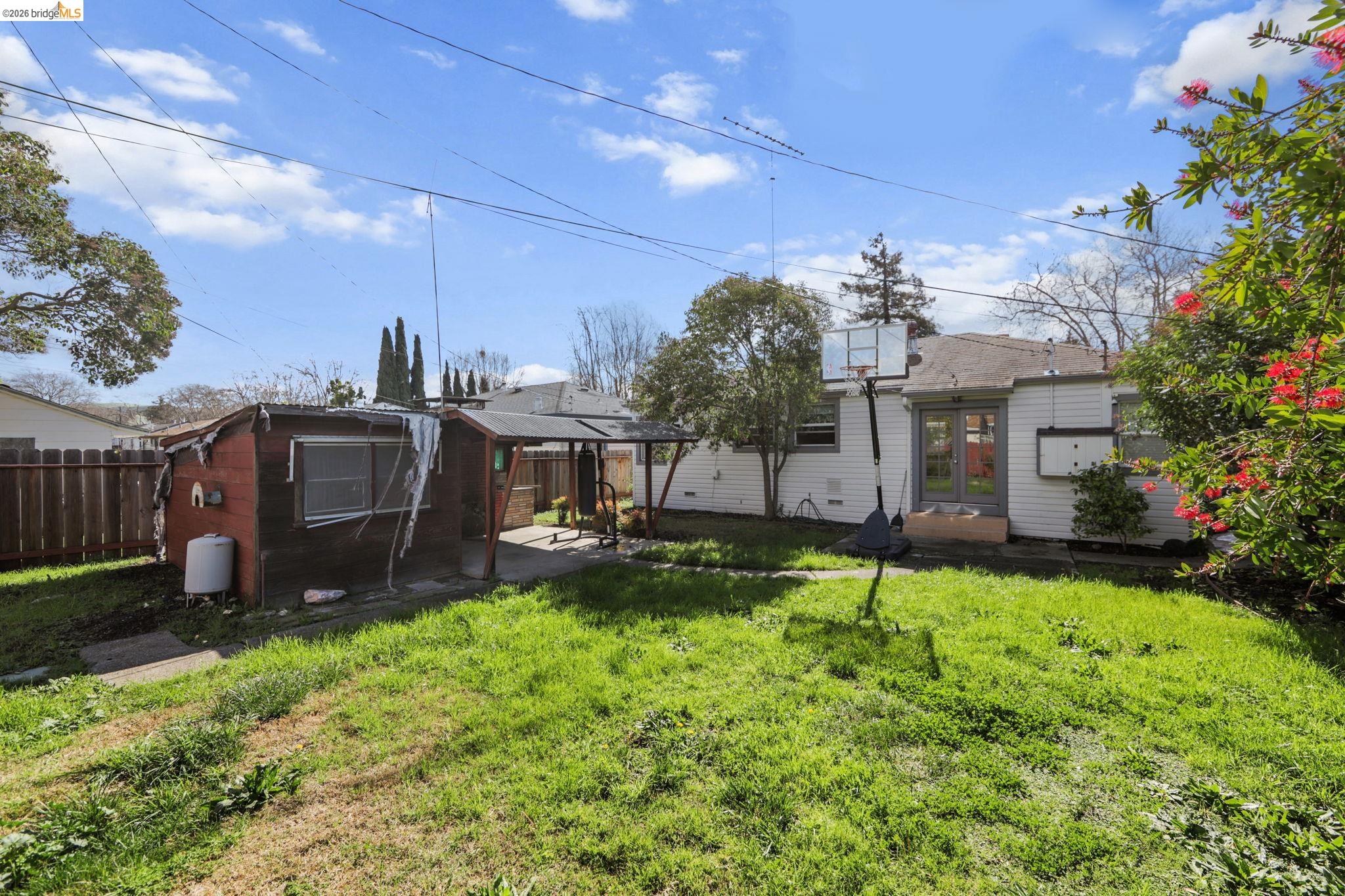 104 Foster Street Vallejo, CA 94591 - Photo 15 of 34 a view of a house with a big yard and potted plants