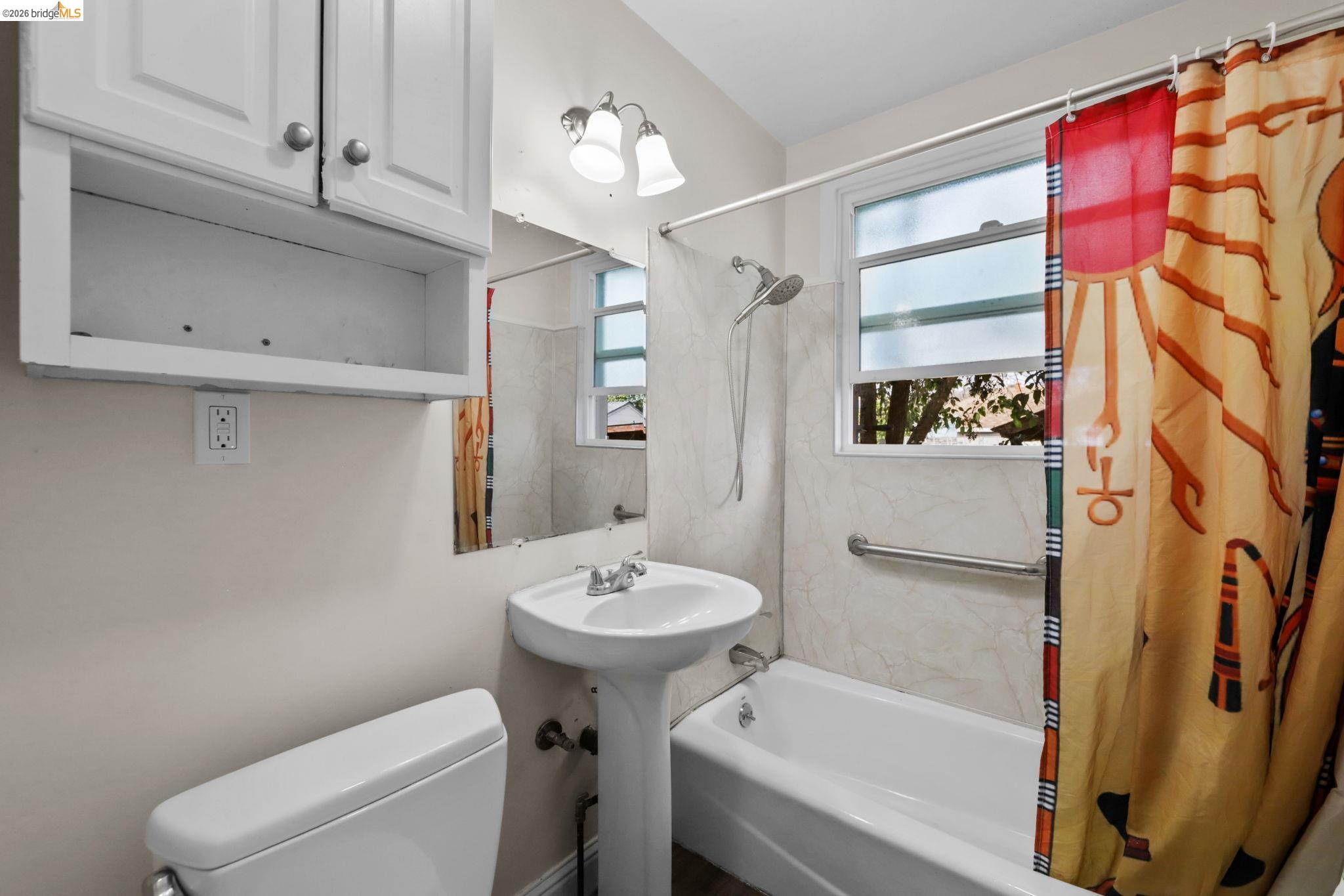 104 Foster Street Vallejo, CA 94591 - Photo 27 of 34 a bathroom with a sink toilet and shower