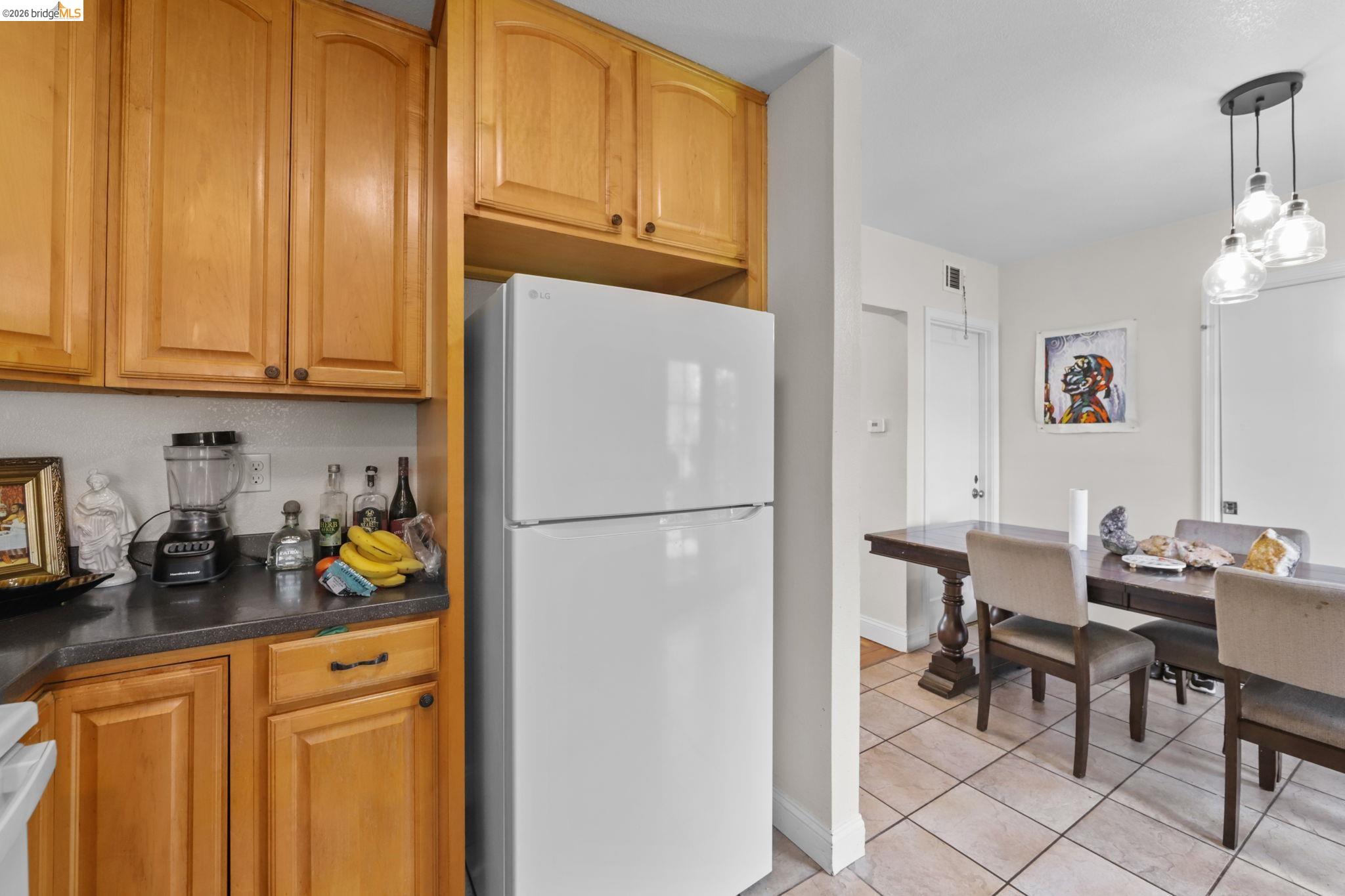 104 Foster Street Vallejo, CA 94591 - Photo 32 of 34 a kitchen with refrigerator and cabinets