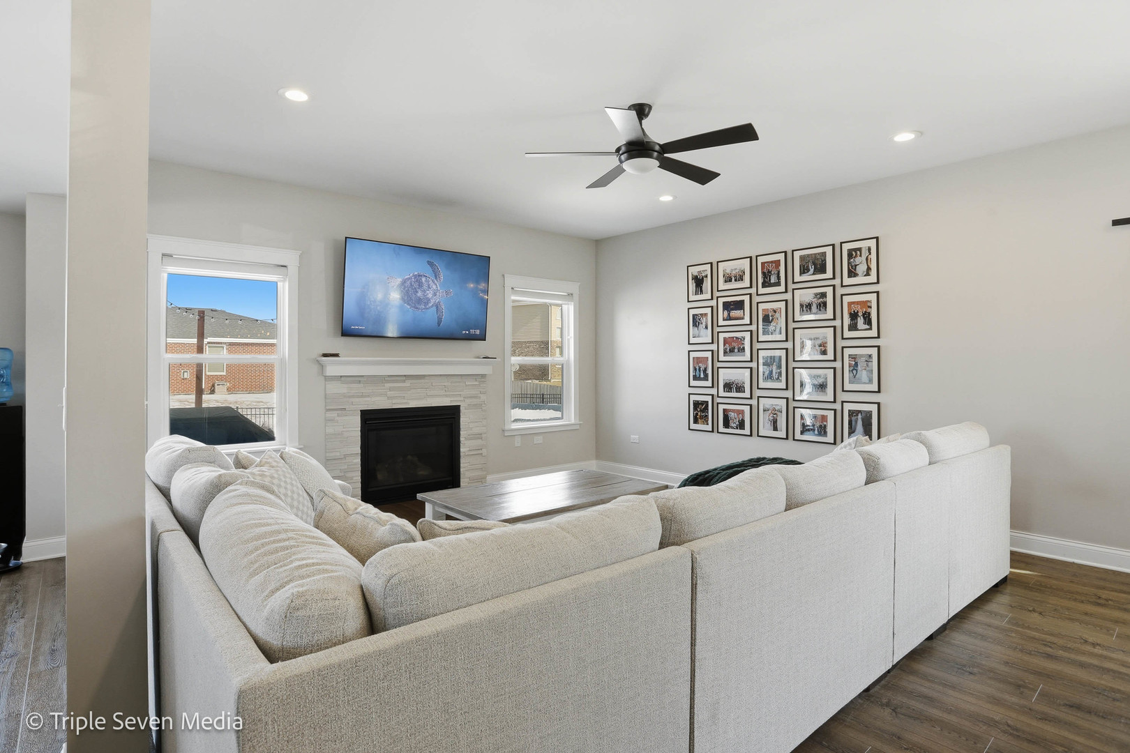 16256 Pinto Lane Manhattan, IL 60442 - Photo 11 of 32 a living room with furniture a fireplace and a flat screen tv