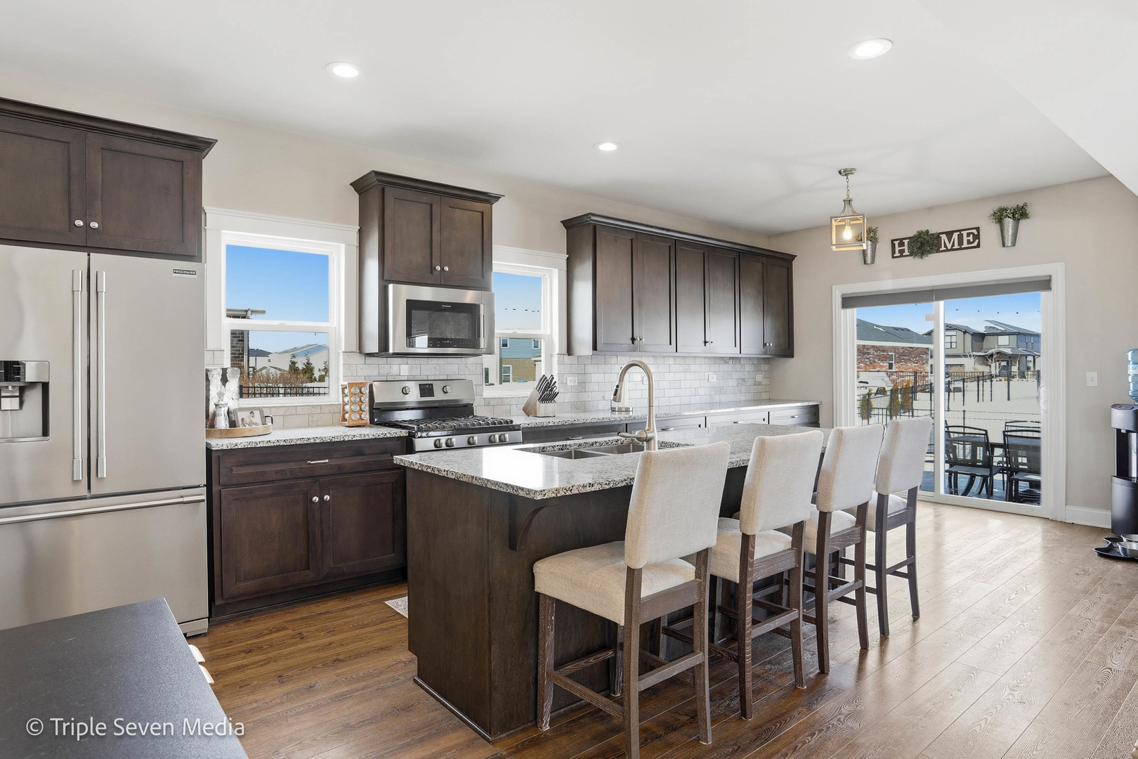 16256 Pinto Lane Manhattan, IL 60442 - Photo 12 of 32 a kitchen with cabinets a sink a counter space stainless steel appliances and cabinets