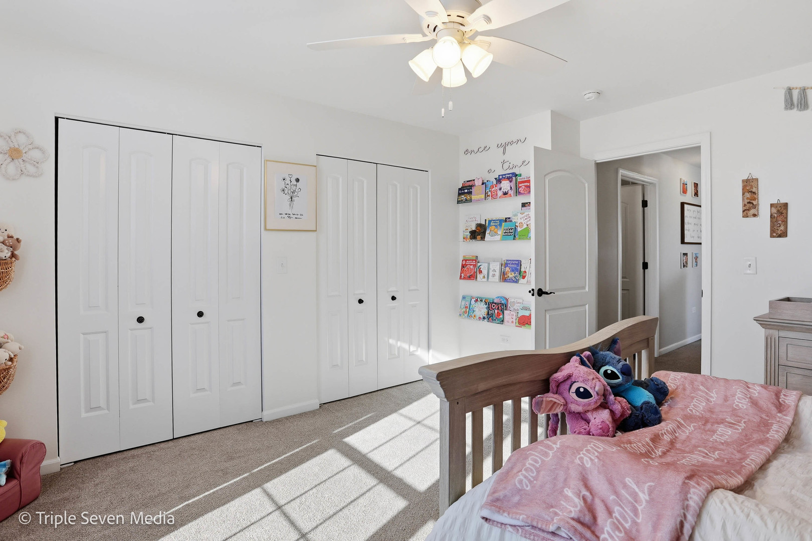 16256 Pinto Lane Manhattan, IL 60442 - Photo 28 of 32 a bedroom with a bed and a chandelier