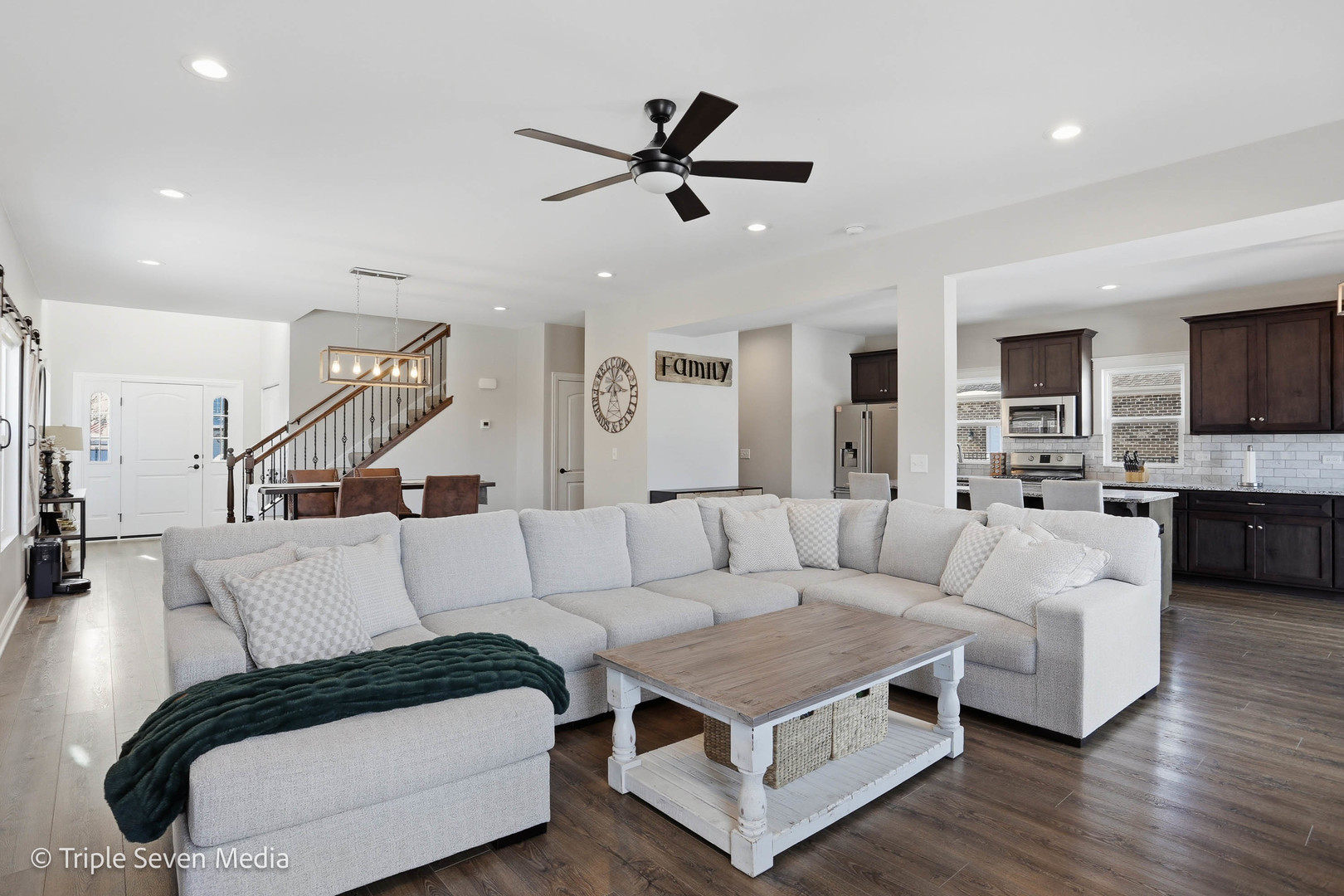 16256 Pinto Lane Manhattan, IL 60442 - Photo 9 of 32 a living room with furniture kitchen view and a wooden floor