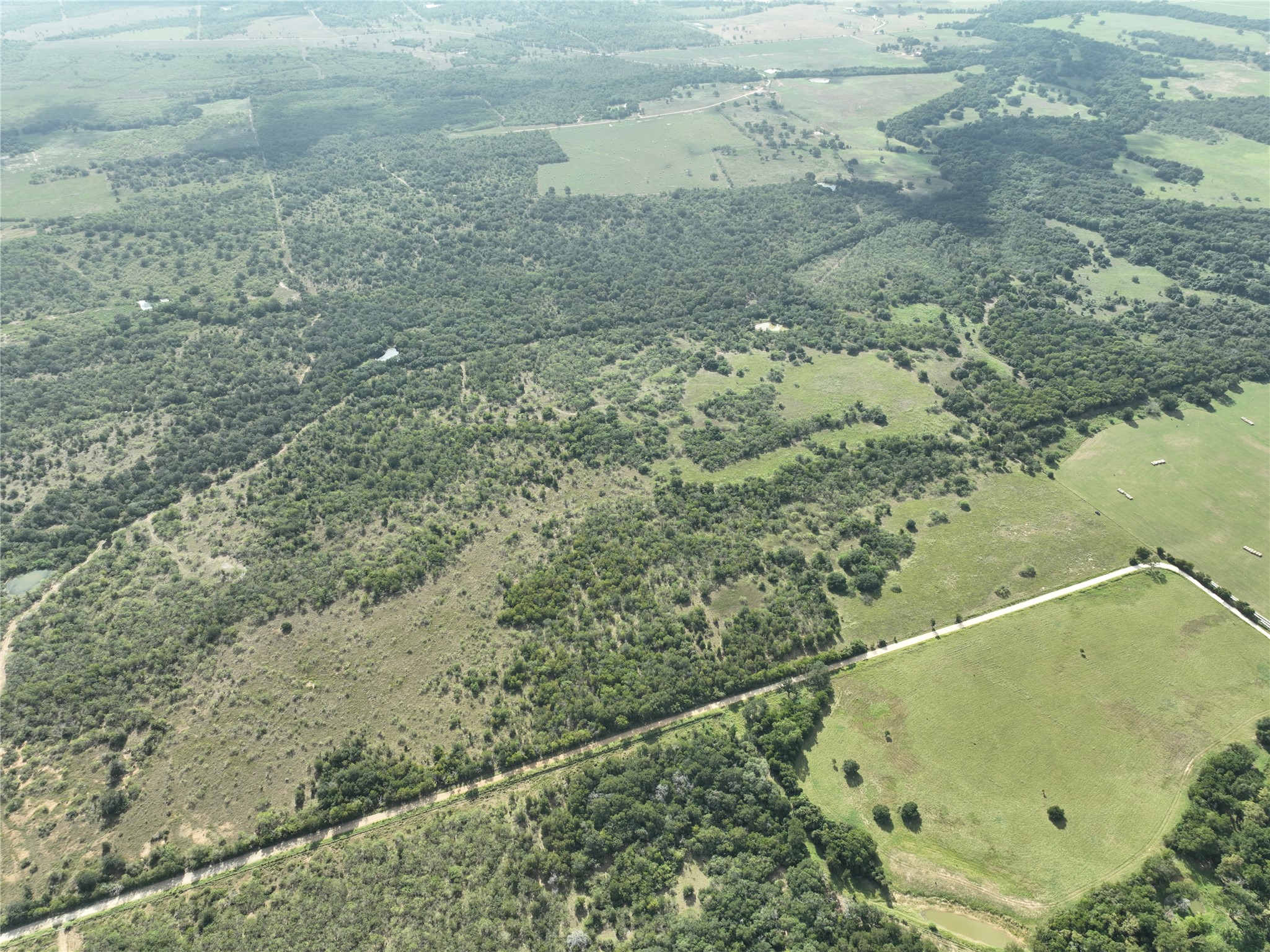 424 Rd Waelder Tx 78629 Road Waelder, TX 78959 - Photo 4 of 25 Aerial view of sparsely populated area with property parcel outlined