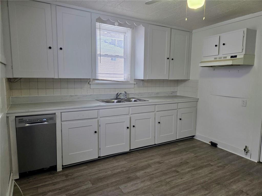 306 Spruce Street Butler, PA 16001 - Photo 11 of 47 a kitchen with white cabinets white stainless steel appliances and sink