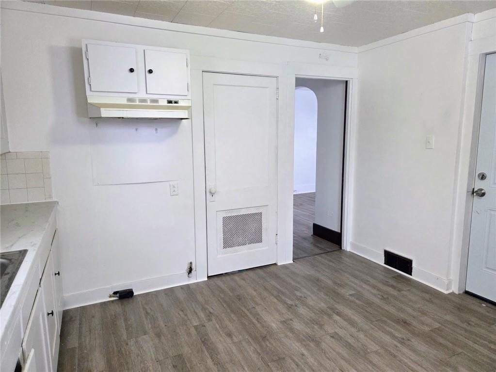 306 Spruce Street Butler, PA 16001 - Photo 12 of 47 a view of kitchen with wooden floor and electronic appliances