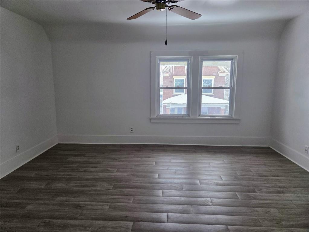 306 Spruce Street Butler, PA 16001 - Photo 17 of 47 wooden floor in an empty room with a window