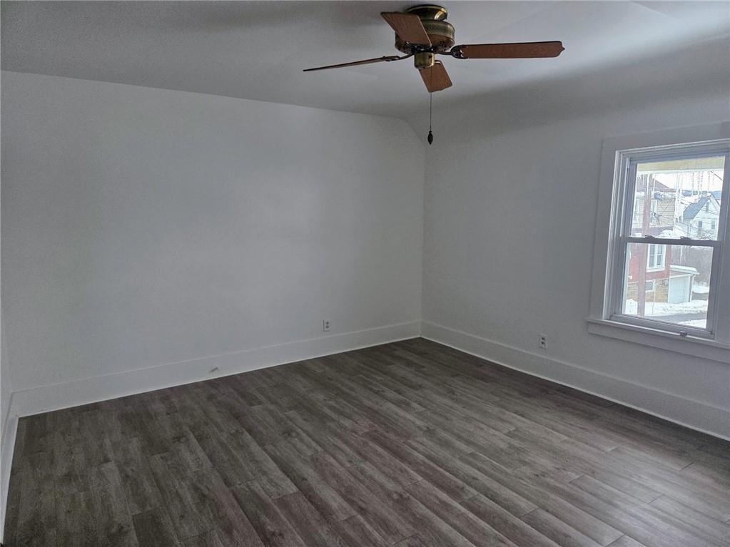 306 Spruce Street Butler, PA 16001 - Photo 19 of 47 wooden floor in an empty room with a window