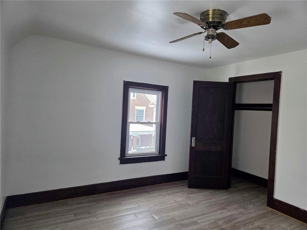 306 Spruce Street Butler, PA 16001 - Photo 26 of 47 a view of an empty room with wooden floor and a window