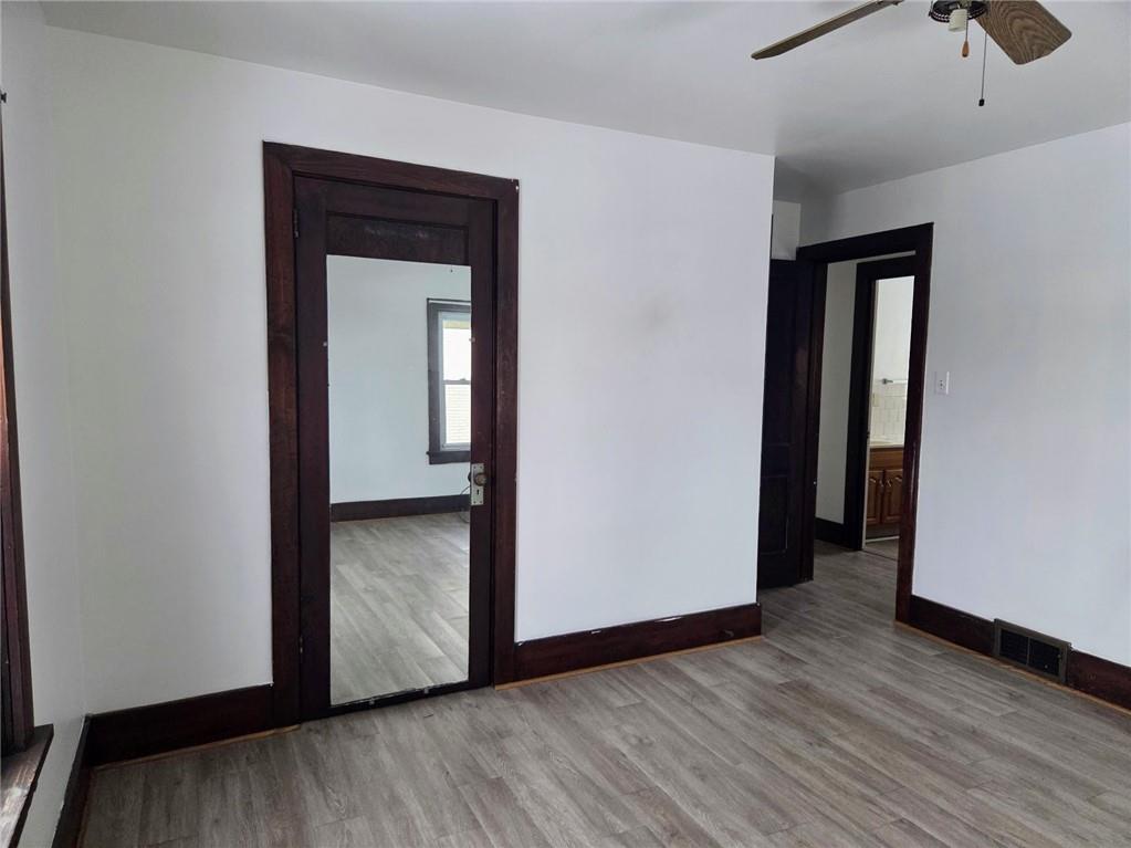 306 Spruce Street Butler, PA 16001 - Photo 27 of 47 a view of an empty room with wooden floor and closet