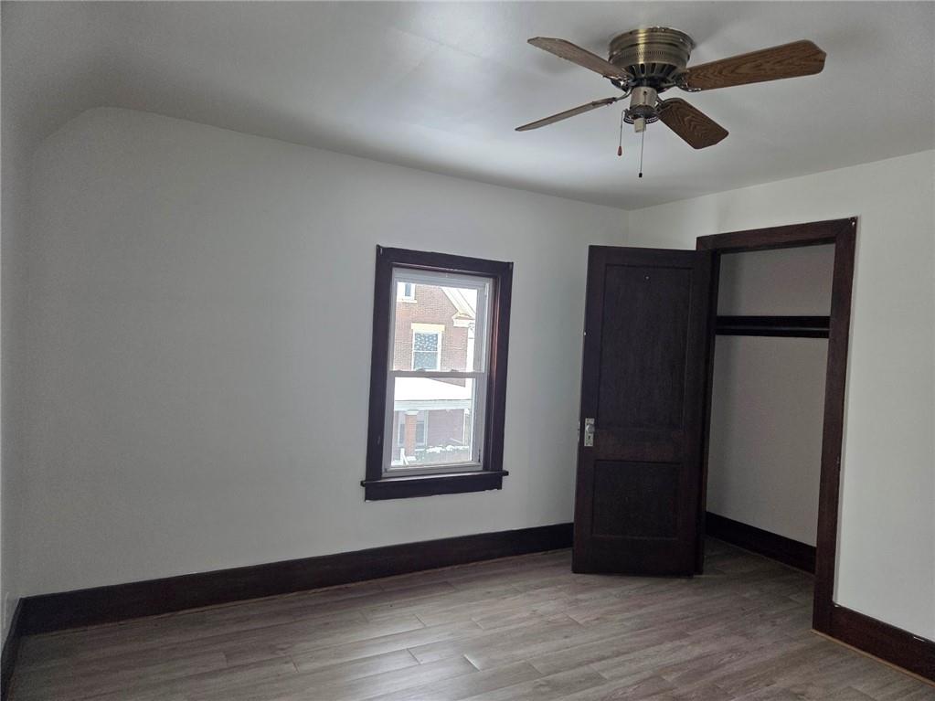 306 Spruce Street Butler, PA 16001 - Photo 44 of 47 a view of an empty room with wooden floor and a window